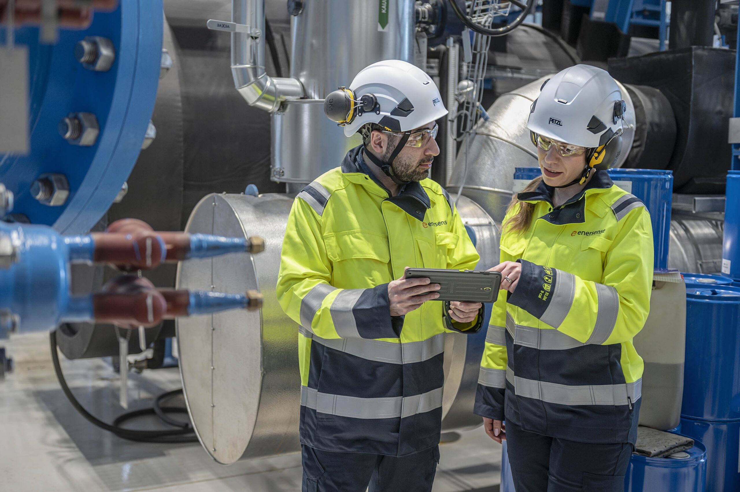 Enersense experts at Vuosaari discussing industrial project solutions